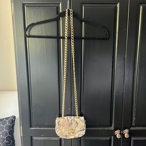 Snakeskin crossbody bag with gold chain
